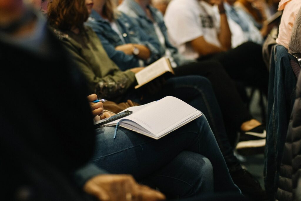 A crowded all hands meeting room with lots of people taking notes could be avoided if you pre record meetings